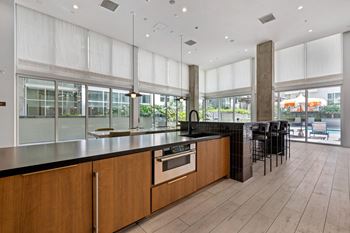 Community kitchen at g12 apartments in los angeles, ca 90015